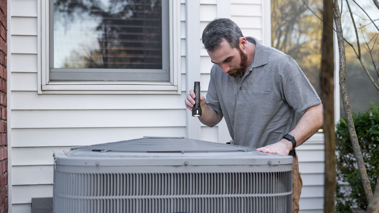 Technician servicing a system